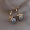 Pearl Bow Hoop Earrings - Blingy Bag LLC